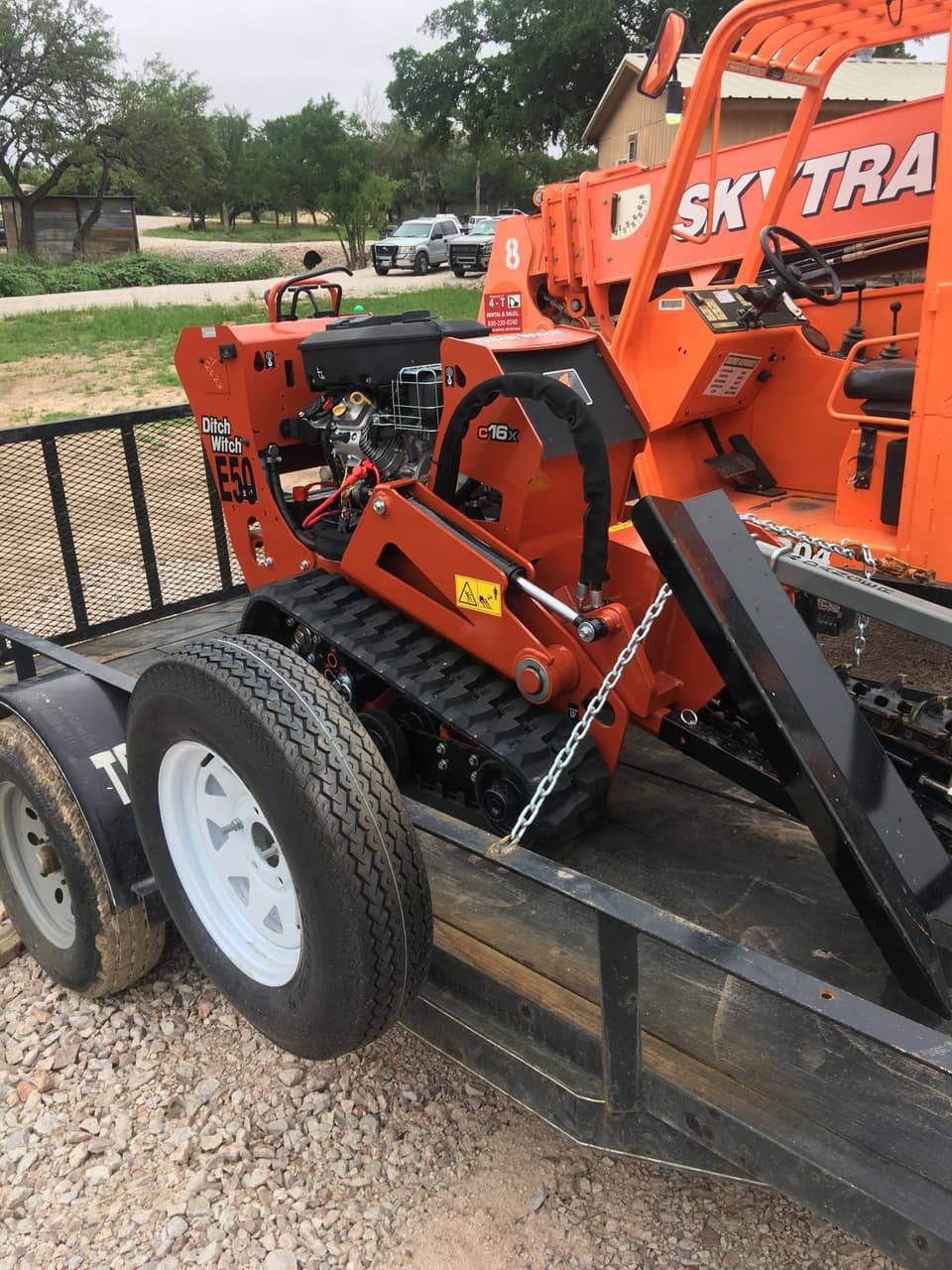 Ditch Witch E50 track trencher on a trailer, side view