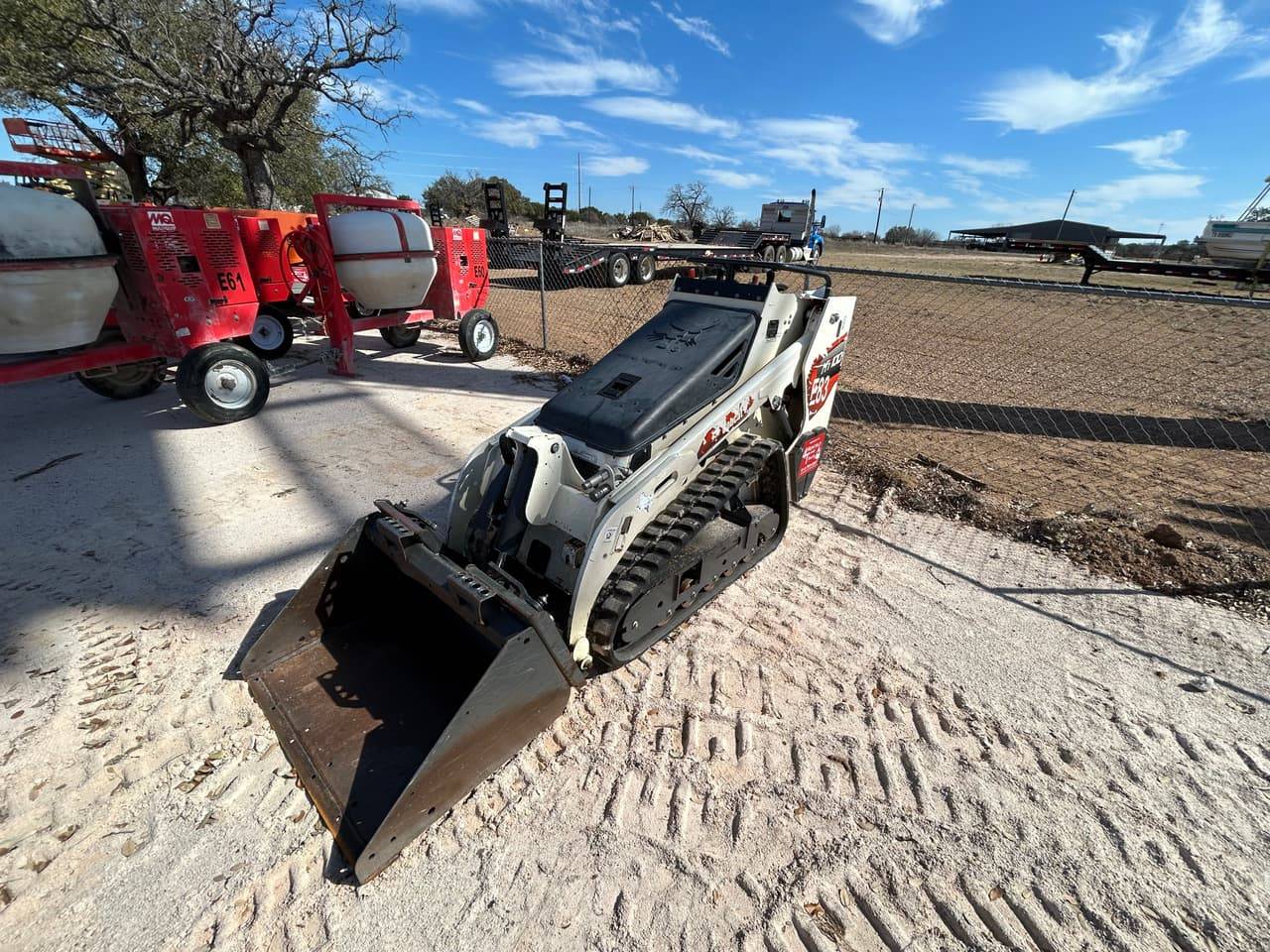 Bobcat stand-on compact track loader with bucket on the 4-T Rental & Sales yard